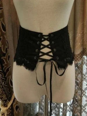 Black Victorian lolita corset bustier back view with metal eyelets and scalloped lace trim on headless dress form