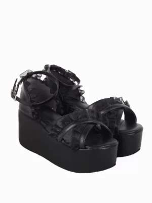 Black Lolita wedge sandals elevated front view displaying thick high platform sole with sheer lace trim details and adjustable ankle strap against white studio background