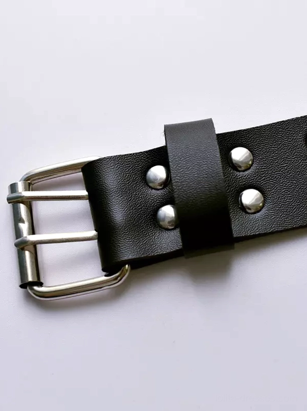 Close-up macro shot of black matte PU leather arm strap showing double-prong silver buckle and metal rivets craftsmanship