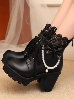 Black lolita ankle boots close-up top view showing lace collar bow decoration and pearl chain strap