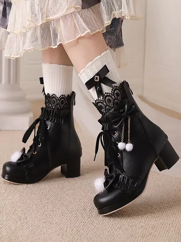 Black lolita boots side view worn styling bow pendant lace-up closure fluffy pompom accent indoor carpet setting