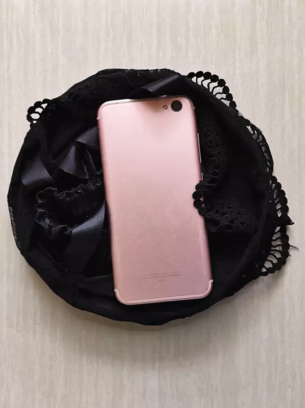 Black Lolita birdcage petticoat scalloped lace hem sample overhead flat view with smartphone for scale reference showing product detail