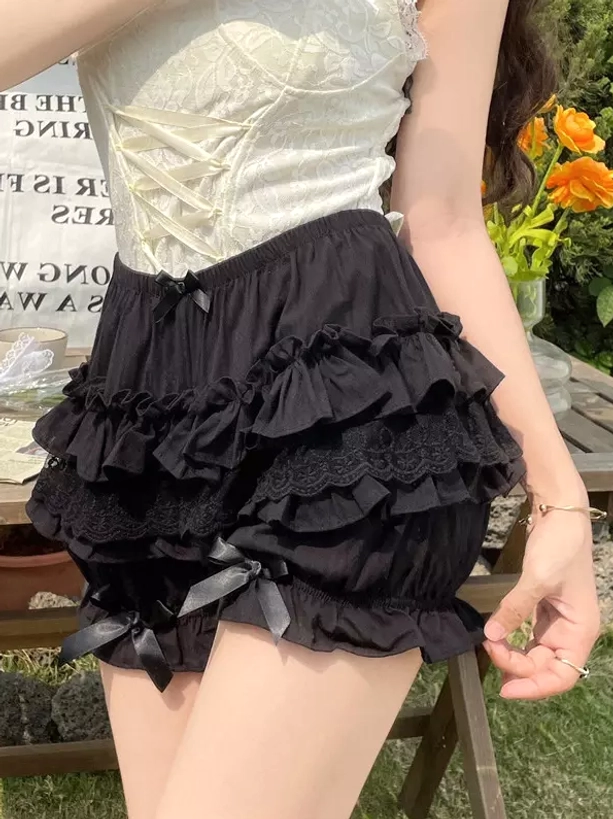 Black lolita bloomers front thigh close-up multiple ruffle tiers lace trim leg bows outdoor garden corset top