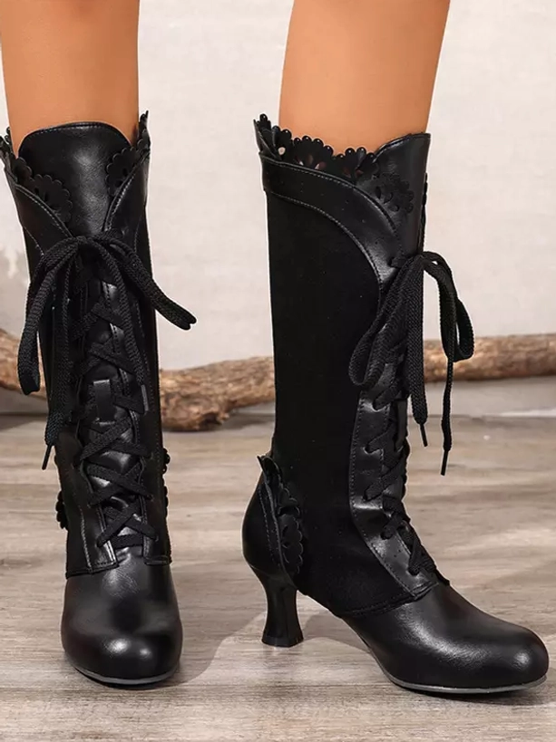 Black vintage Lolita heeled boots front double-leg model display showing full smooth leather upper, lace-up design, and scalloped collar detail