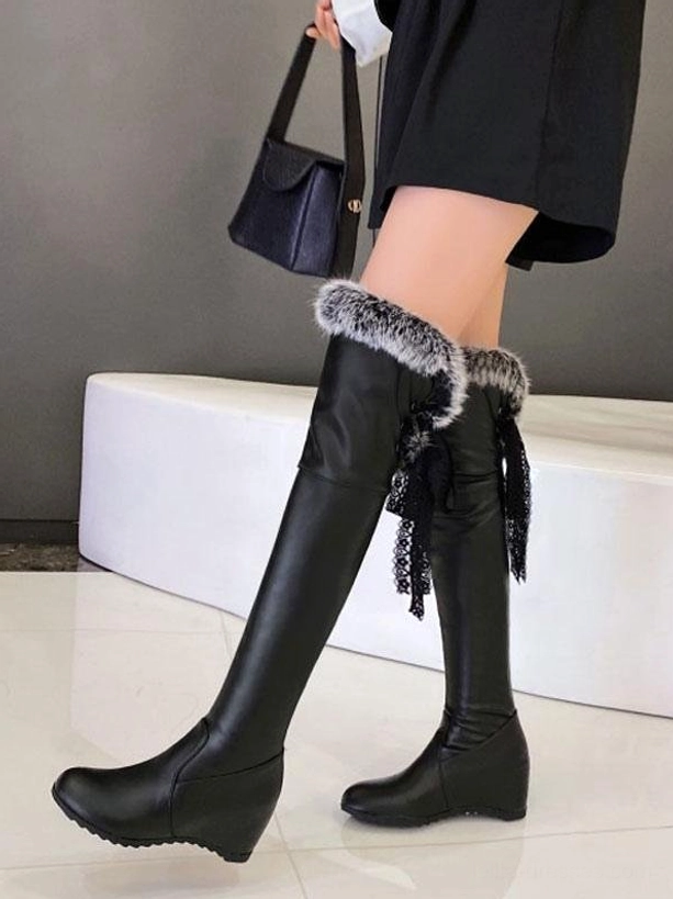 black leather over-the-knee lolita boots with grey-tipped fur collar and black lace tassel decoration worn with black skirt