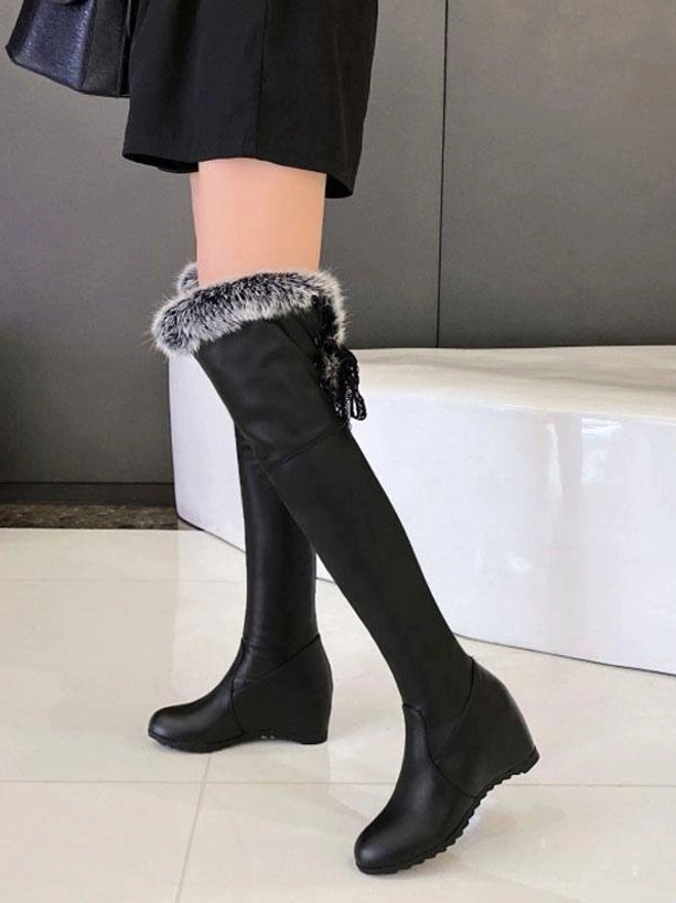 black faux leather lolita boots with grey fur trim and decorative back lace tassel front standing view
