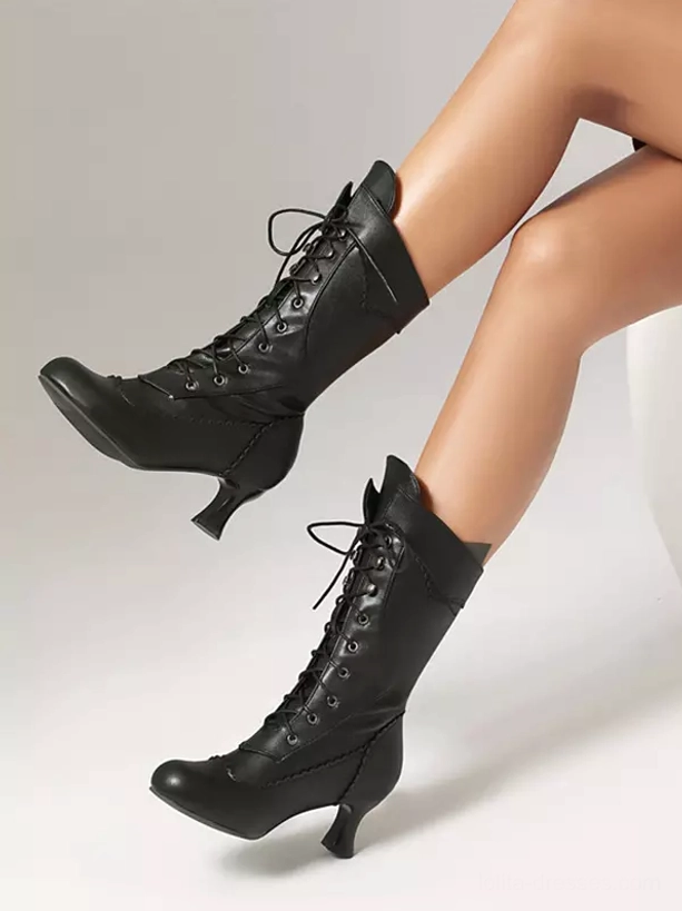 Black vintage mid-calf lolita boots side profile view showing tapered kitten heel and lace-up closure