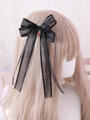 black-lolita-bow-hair-accessory-with-red-heart-cross-charm-back-view-mannequin-display