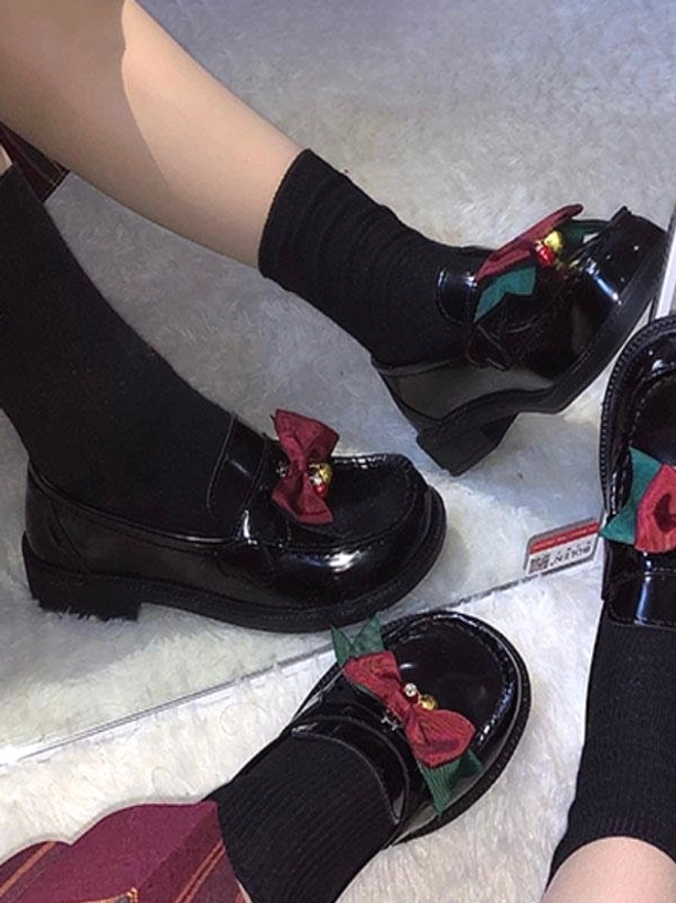Black lolita bow pumps overhead close-up feet shoes detail glossy brown pu leather red-green bow bell accent black ankle socks
