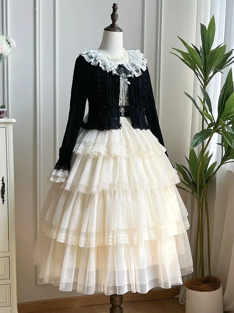 Black lace collar lolita cardigan layered with multi-layered tulle skirt on dress form elegant gothic-inspired lolita coordinate