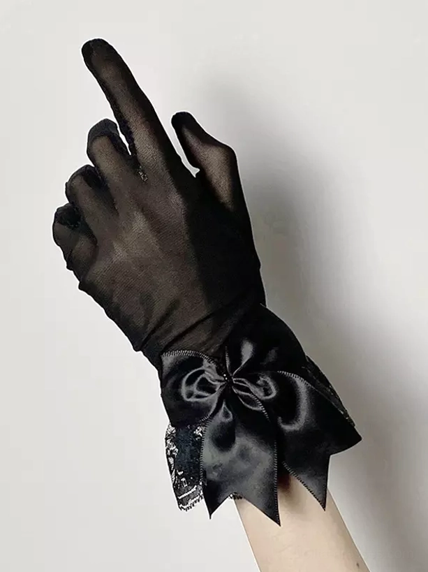 Close-up of black gothic lolita glove featuring prominent satin bow with lace underlay, full finger sheer mesh design and delicate embellishment