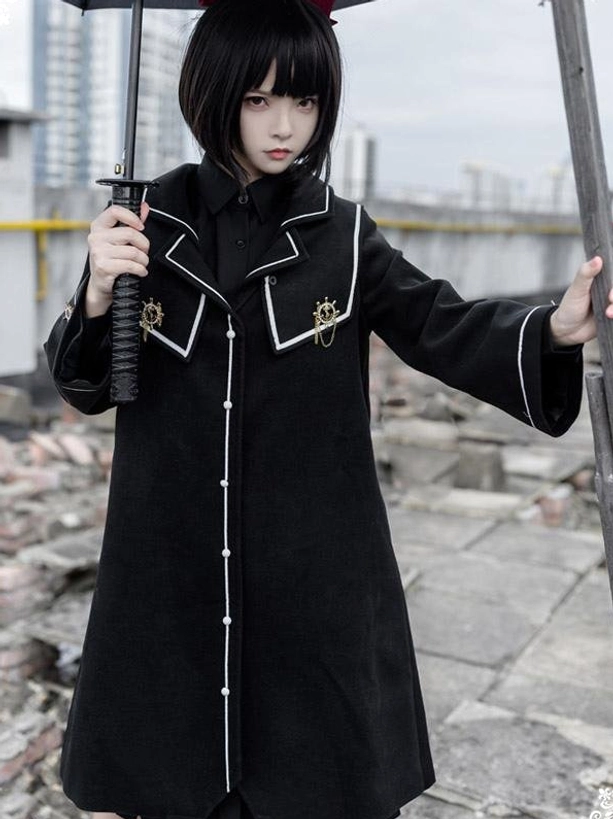 Black lolita overcoat right three-quarter angle showing long sleeves white trim details metal emblems academic style coat for lolita fashion