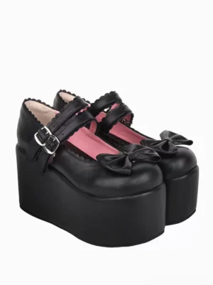 Black lolita Mary Jane sandals featuring scalloped shoe collar and bow decoration, three-quarter rear-side view showcase