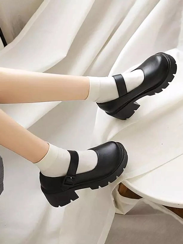 Black Mary Jane Lolita pumps floating side view thick lug platform sole smooth leather finish