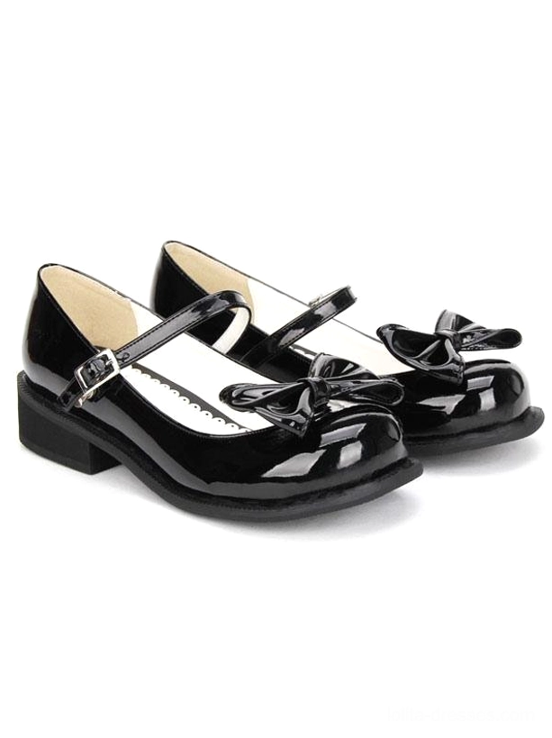 black lolita mary jane shoes side profile view chunky low heel buckle ankle strap front bow patent leather round toe silhouette