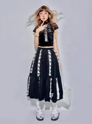 Black lolita midi skirt three quarter view with vertical gothic white embroidery patterns