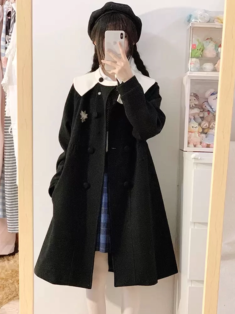 Black lolita overcoat side view paired with plaid skirt, contrast white collar, double-breasted buttons, worn with black beret in fitting room