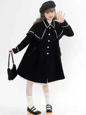 Black Sweet Lolita wool overcoat side-front view showing decorative contrast white trim, button closure, and elegant A-line silhouette with beret styling