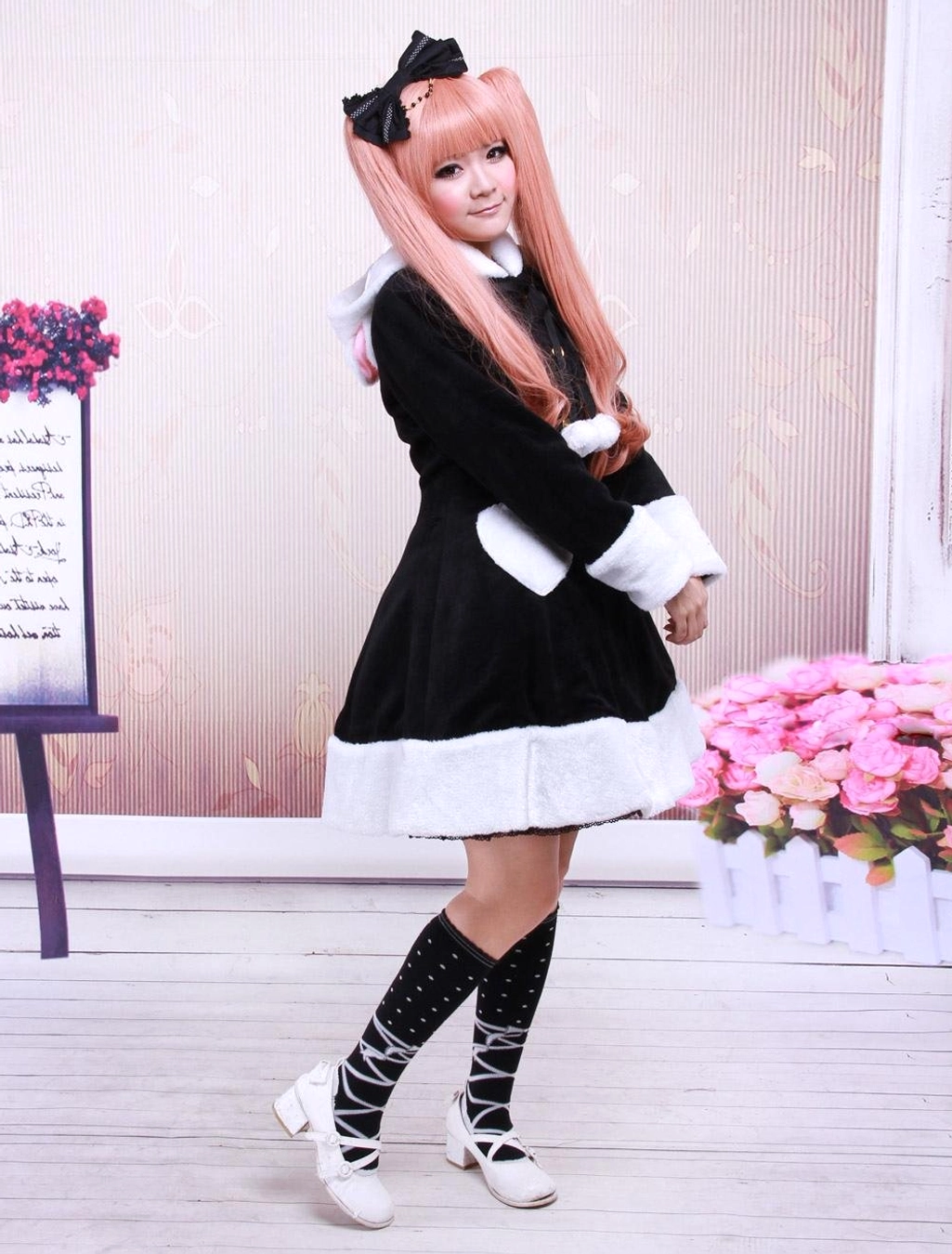 Full side profile of black lolita wool overcoat showing elegant proportions with cross-laced black socks and Mary Jane flats