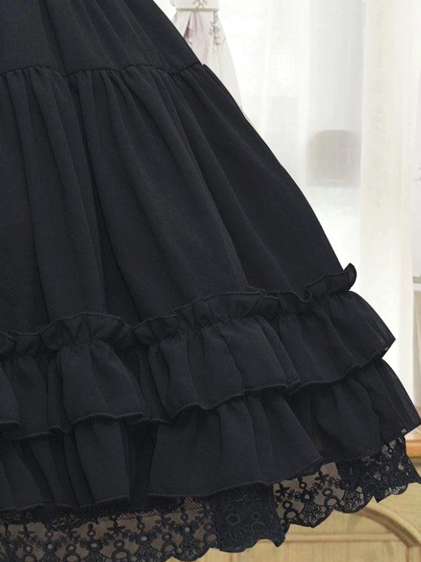 Black Lolita petticoat partial close-up front low view tiered ruffled trim black lace hem detail solid dark fabric