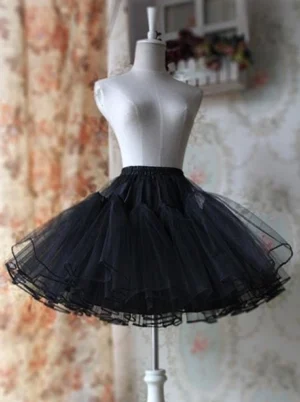 Black layered tulle lolita petticoat front view showcasing structured volume on dress mannequin with ruffled hem detail