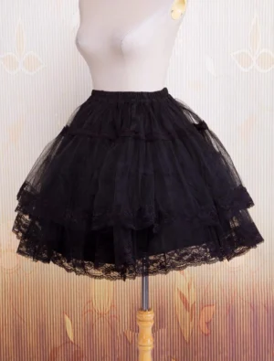 Black organza lolita petticoat front direct view showcasing tiered black tulle layers and delicate lace edge hem detail with elastic waistband construction