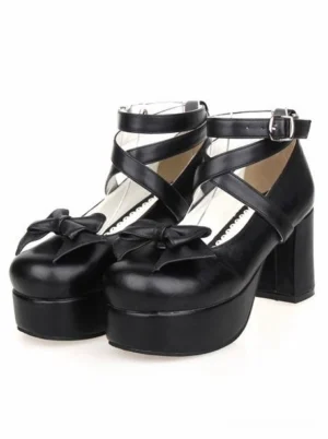 Black gothic lolita platform heels with cross ankle straps and decorative bow, front flat view showcasing matte PU leather finish and chunky block heel