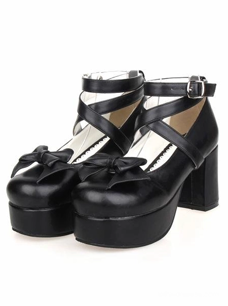 Black gothic lolita platform heels with cross ankle straps and decorative bow, front flat view showcasing matte PU leather finish and chunky block heel