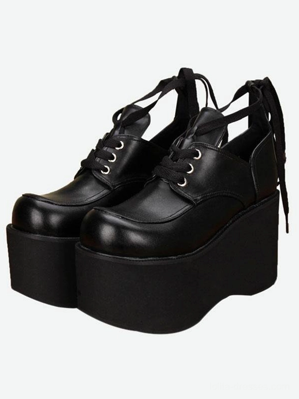 Black platform lolita shoes oblique front pair view showing high block platform sole and back ribbon fastening detail