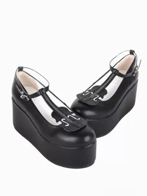 Black T-strap Lolita platform shoes side three-quarter angle displaying decorative heart buckle embellishment and romantic strap design