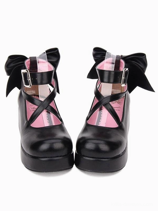 Black Lolita platform wedge shoes with cross-strap ankle bow detail, pink interior lining visible, front direct view
