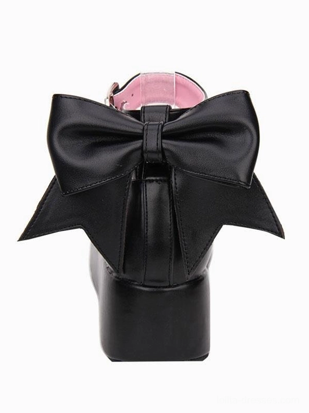 Single black Lolita platform wedge shoe rear view showcasing large decorative bow and thick block heel with pink interior lining