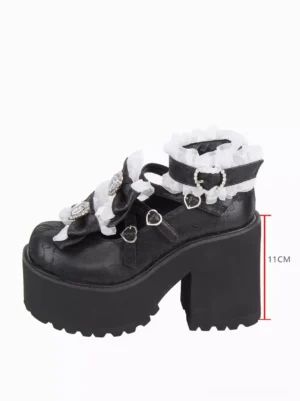 Side profile of black chunky heel lolita pumps showing 11cm heel height measurement and thick block platform construction with embossed PU leather