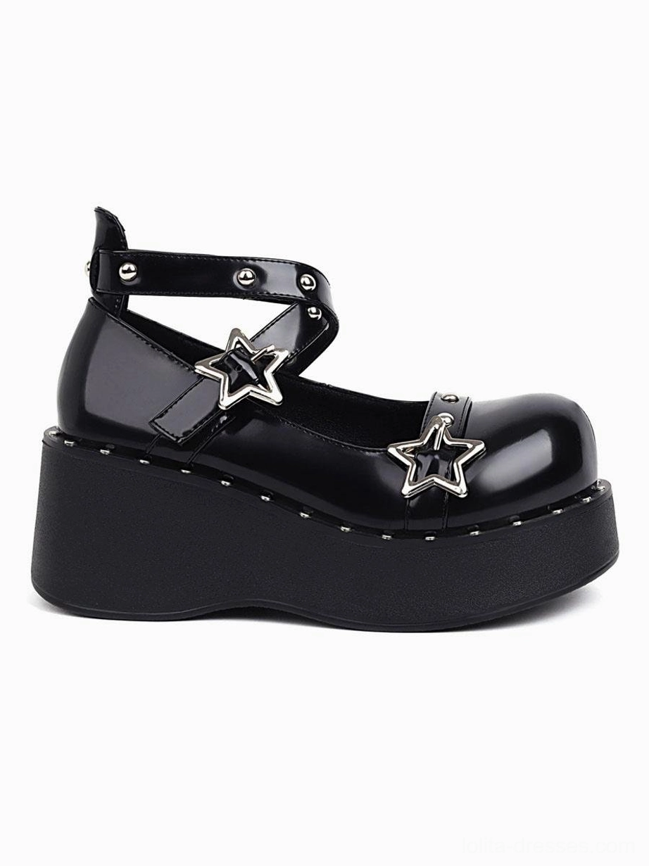 Single black patent leather lolita shoe full lateral side view showing smooth finish, silver star accents, and studded ankle strap construction