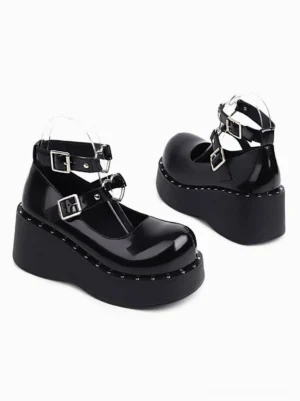 Black patent leather academic lolita shoes side rear paired view showing t-strap buckle design rounded toe studded sole edge