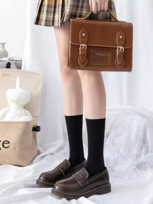 black calf-length lolita socks sheer fabric tight front view loafers plaid skirt leather bag styling