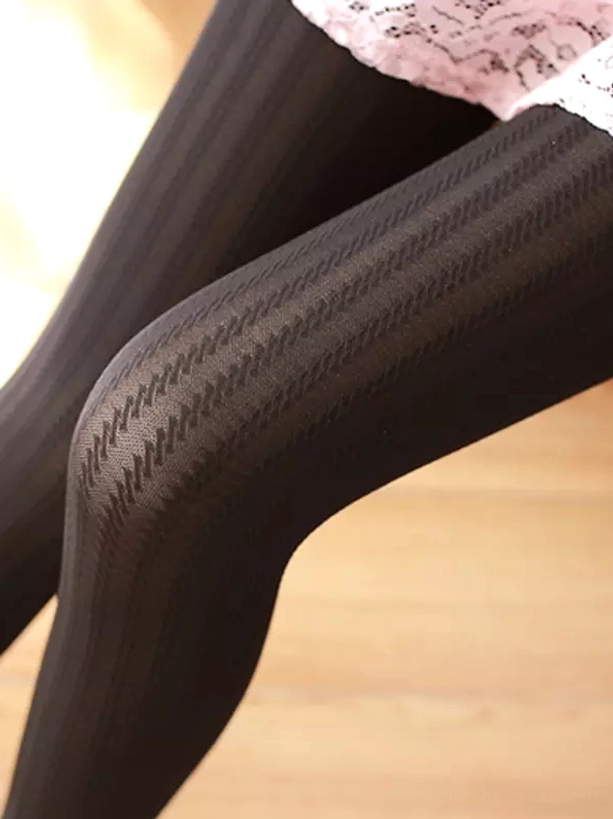 Black textured Lolita tights zigzag vertical stripe pattern close-up knee detail view