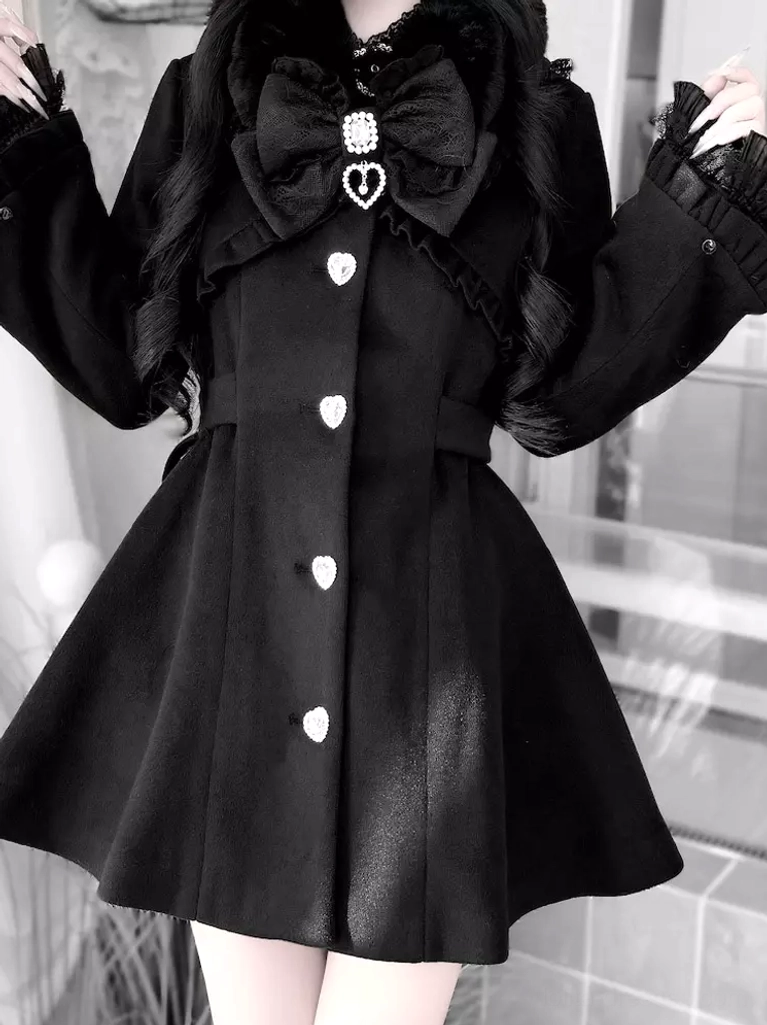 Black Lolita winter coat close-up detail showing fitted waist, heart-shaped front buttons, ruffled lace cuffs, and upper torso
