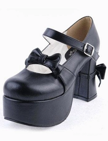 Close-up side-front single shoe detail of black lolita Mary Jane platform heels showcasing front bow decor thick platform and buckle strap