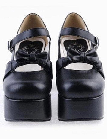 Front-facing display of black matte lolita Mary Jane platform heels featuring central decorative vamp bow and clean solid design