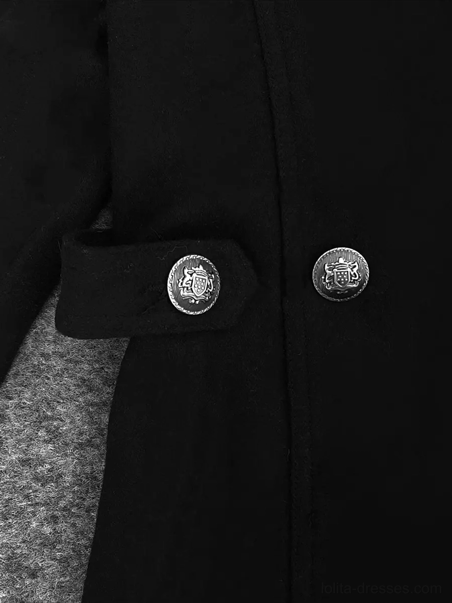 Extreme close-up texture of smooth black polyester fabric with embossed round metal buttons, showing premium wool-like material quality and button embellishments