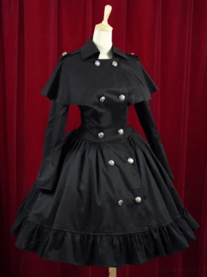 Black military lolita dress with wasp waist and silver buttons front three-quarter view on mannequin with ruffled skirt hem