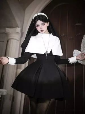 Black nun-style gothic lolita dress front three-quarter view with cross necklace and flared short skirt on model in vintage church setting