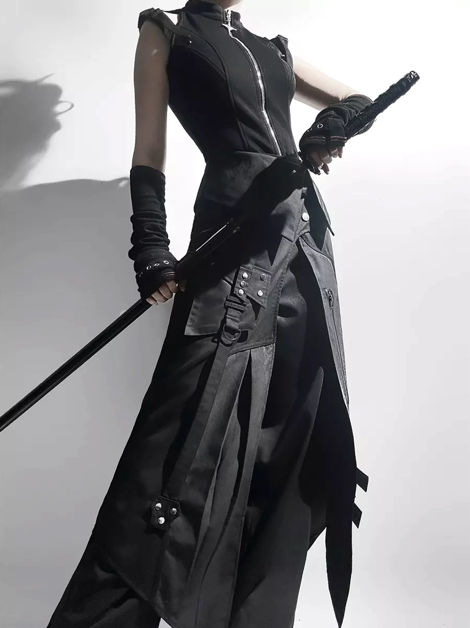 Black gothic Ouji Lolita outfit side three-quarter view showing asymmetrical hem skirt and wide-leg pants with buckle accents