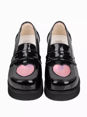Paired black patent leather Lolita platform shoes front view featuring heart-shaped buckle strap and branded insole detail
