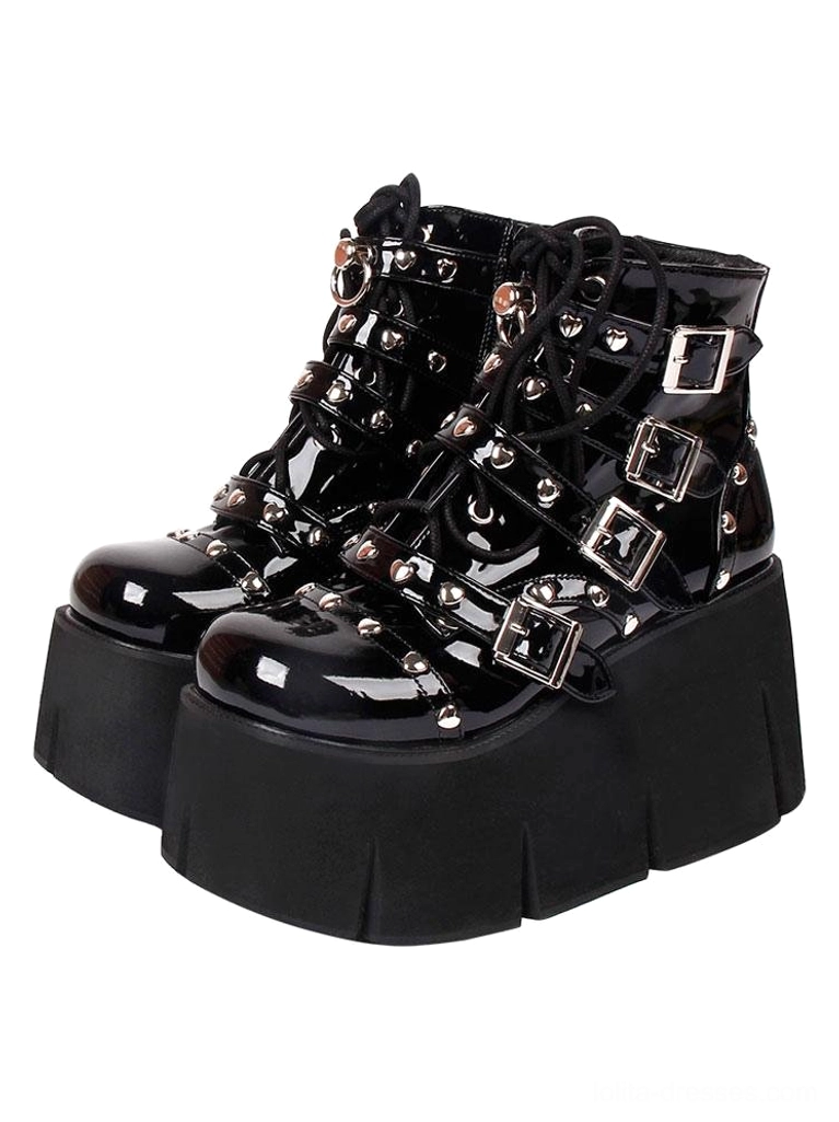 Black patent leather Lolita platform boots front three-quarter view showing silver studded buckle straps chunky wedge heel thick sole