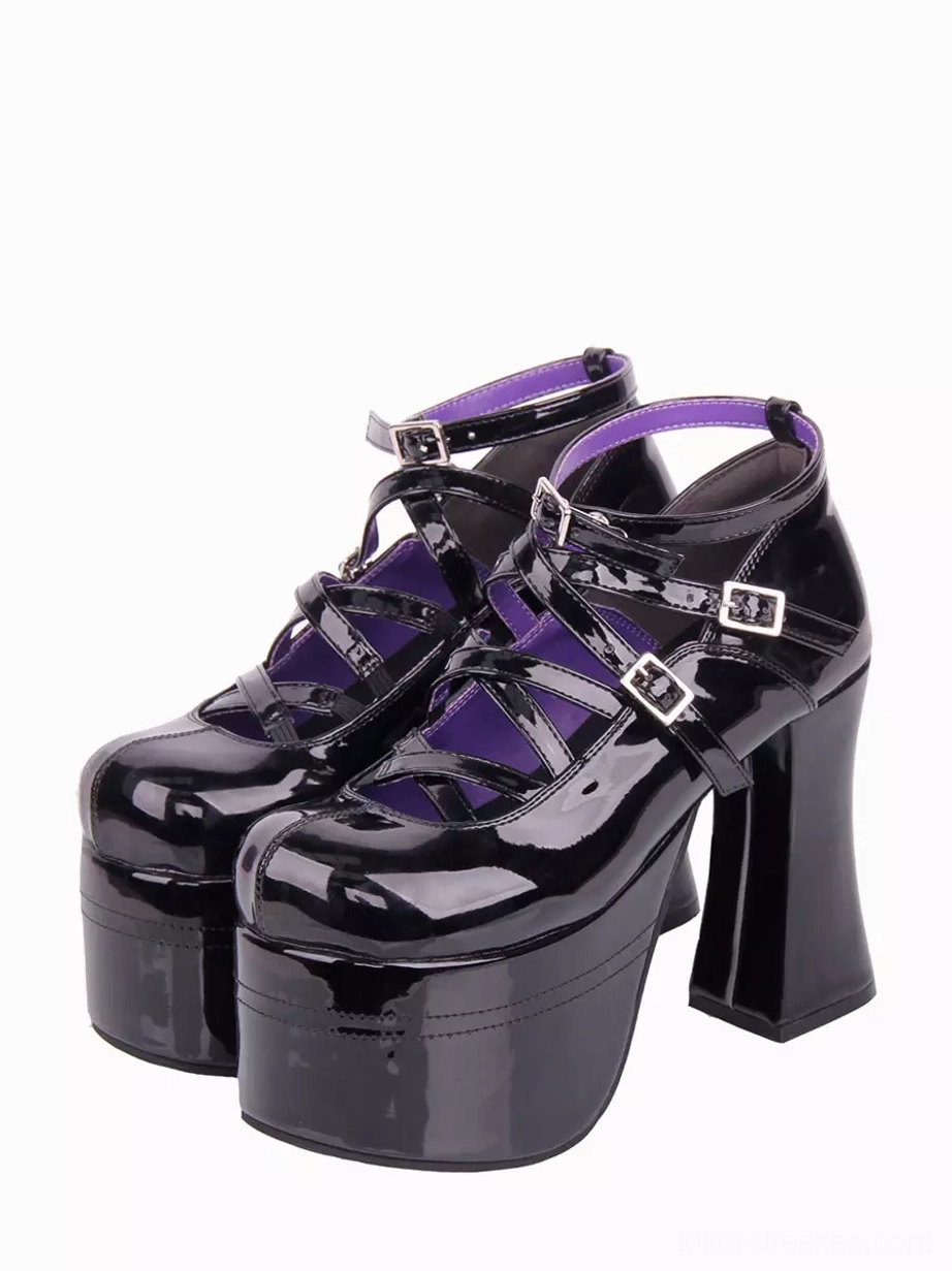 Black patent leather Lolita platform pumps front three-quarter view showing dual ankle buckle straps glossy PU finish purple interior lining