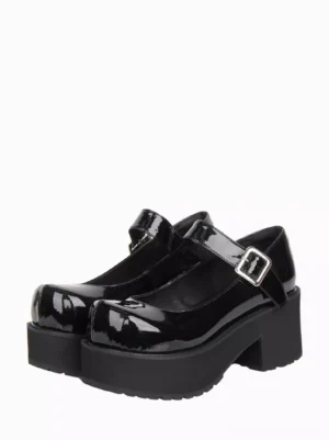 Black patent leather Mary Jane platform lolita shoes with chunky block heel and round toe displayed in three-quarter front view showing adjustable silver buckle strap detail