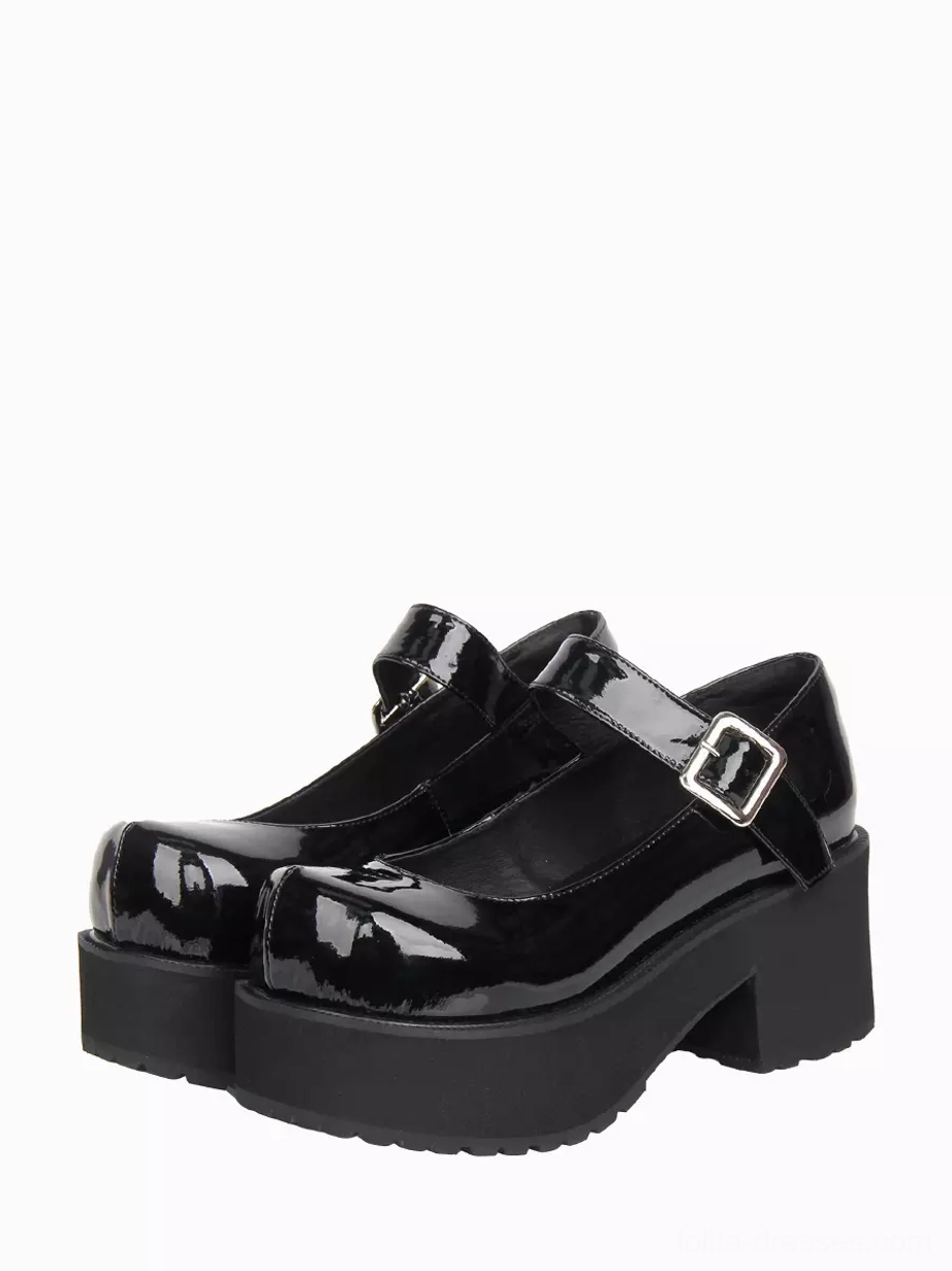 Black patent leather Mary Jane platform lolita shoes with chunky block heel and round toe displayed in three-quarter front view showing adjustable silver buckle strap detail