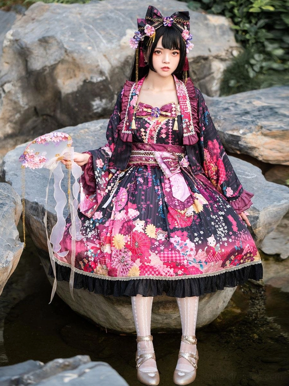 Black and pink floral lolita dress 3-piece set full-body view showing square neckline matching hair bow and ruffled trim sitting on stone